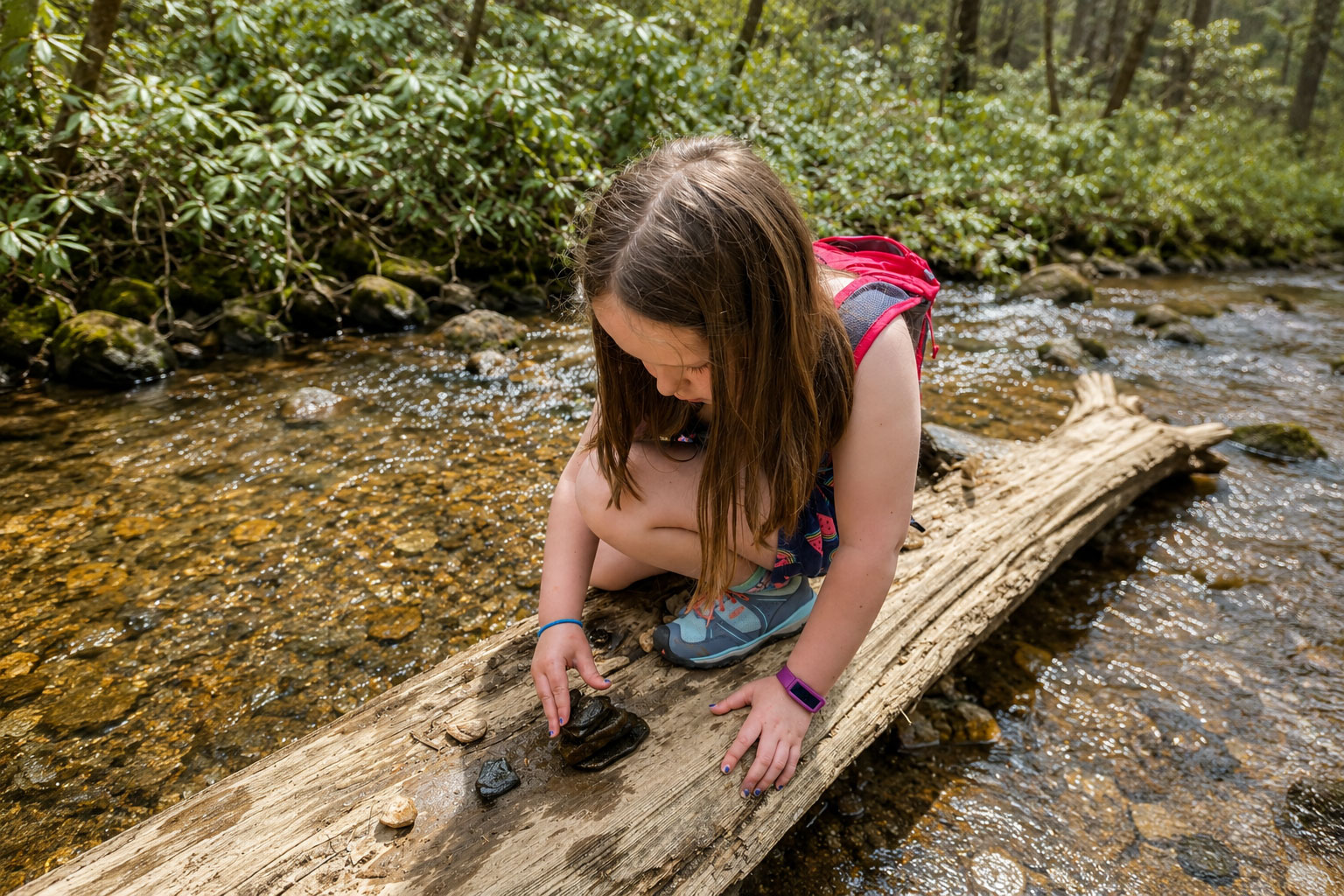 child playing in a stream